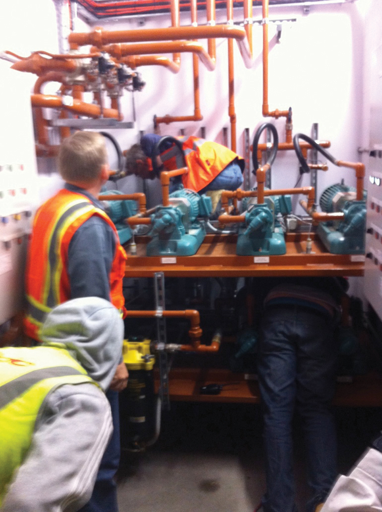 Figure 3. A commissioning team operating valves manually to properly test a fuel supply system. Prior to Uptime Institute’s arrival for the TCCF, this task had not been performed.
